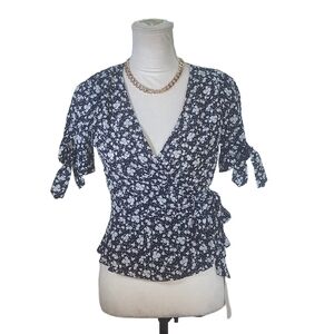 Wild Jasmine. Black and White, floral peplum shirt. Size small